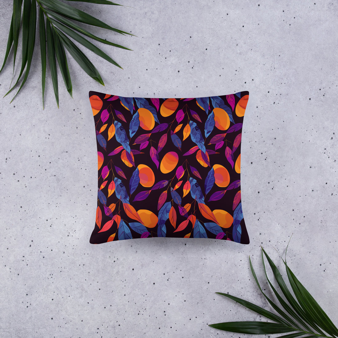 Decorative pillow with vibrant autumn leaves in orange and purple on a dark background