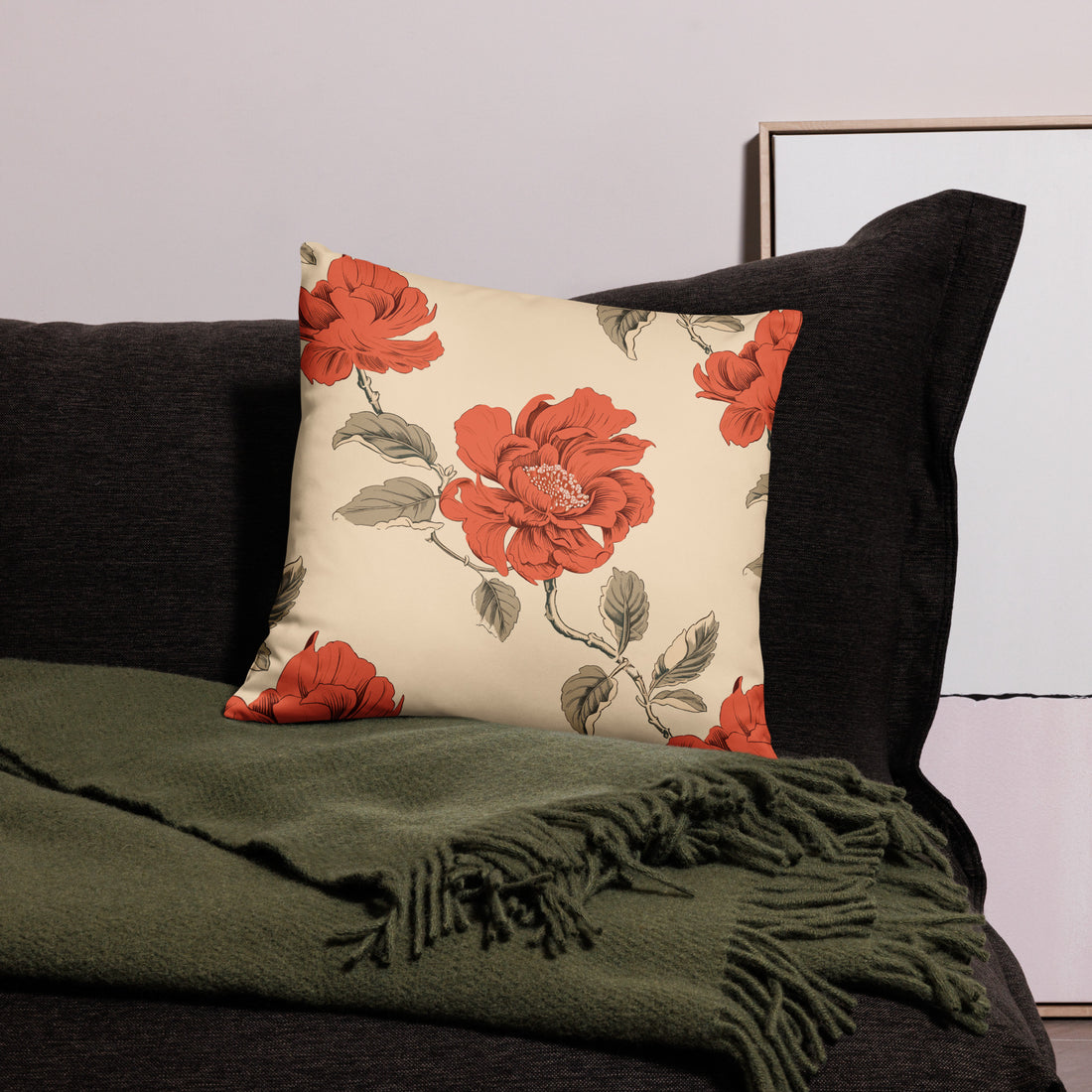 Red peony floral accent pillow on a dark couch, ideal for holiday and winter decor, soft and machine-washable