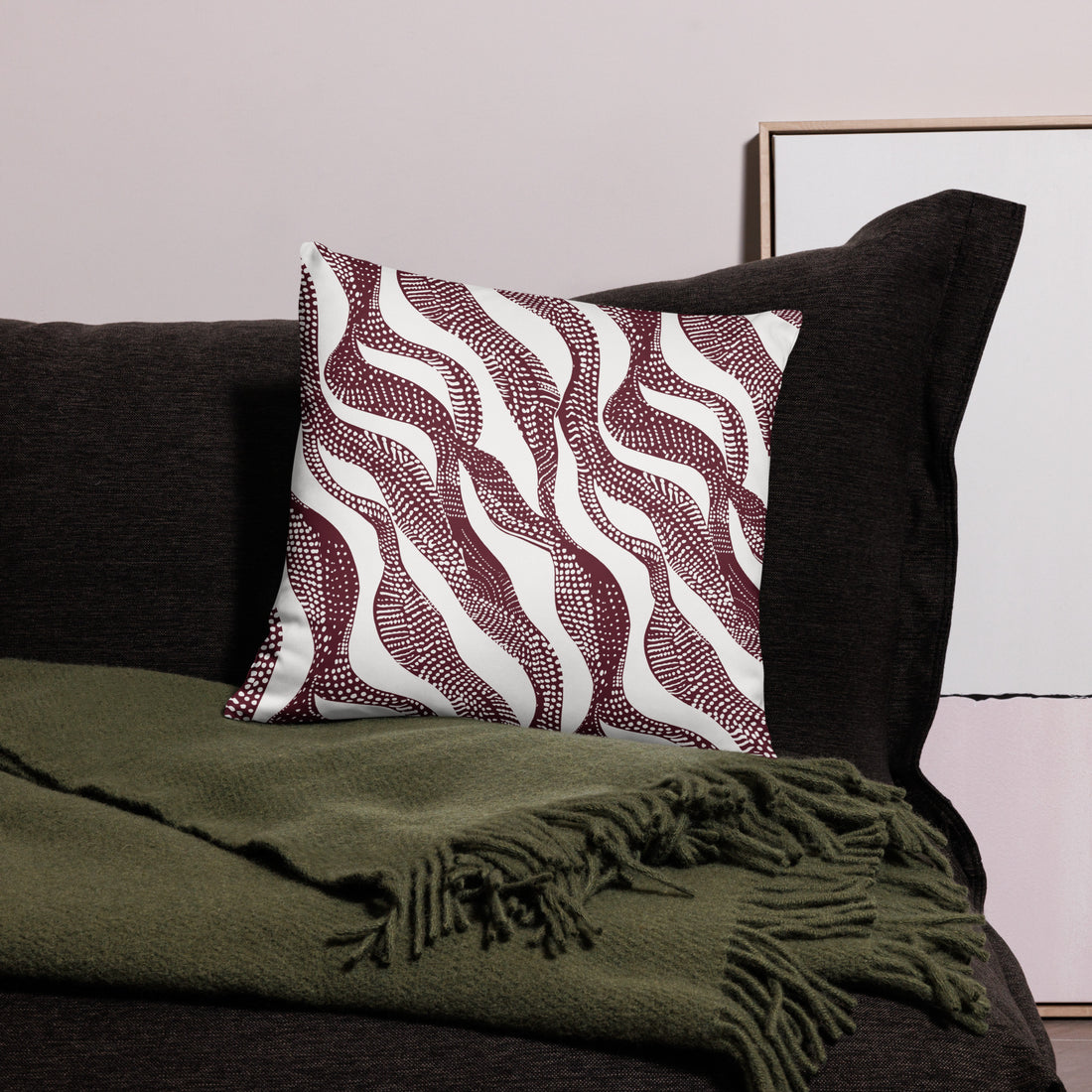 Holiday Maroon Abstract Waves Knitted Pillow with a unique maroon abstract waves knitted design, soft polyester case, and hidden zipper.