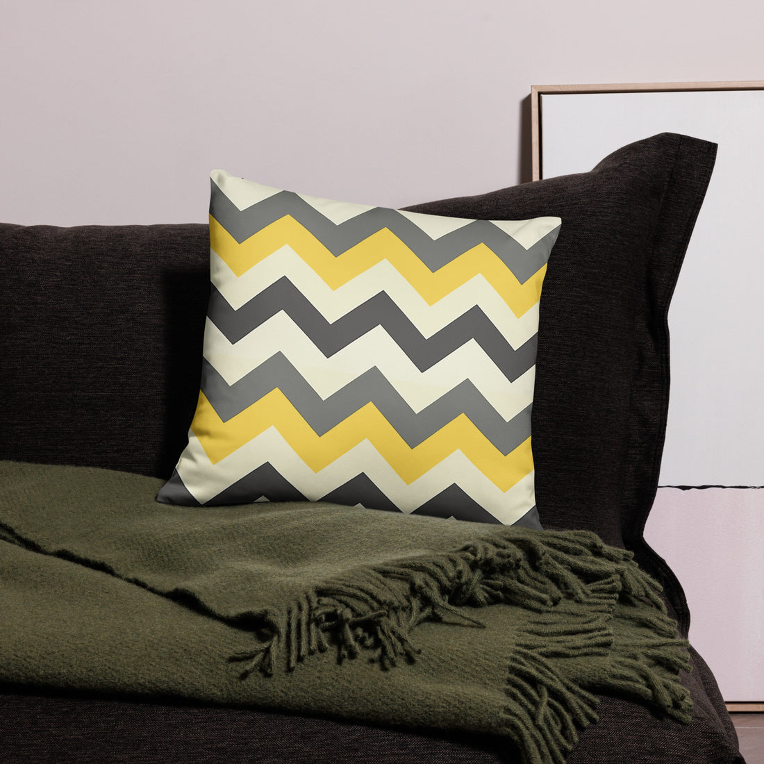 Chevron Pattern Decorative Pillow in yellow and gray on dark sofa.