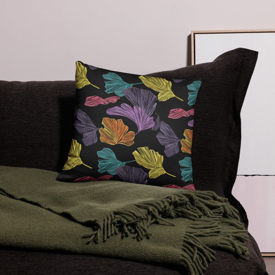 Pillow with colorful ginkgo leaf design on a dark background, featuring vibrant multicolors suitable for winter decor.