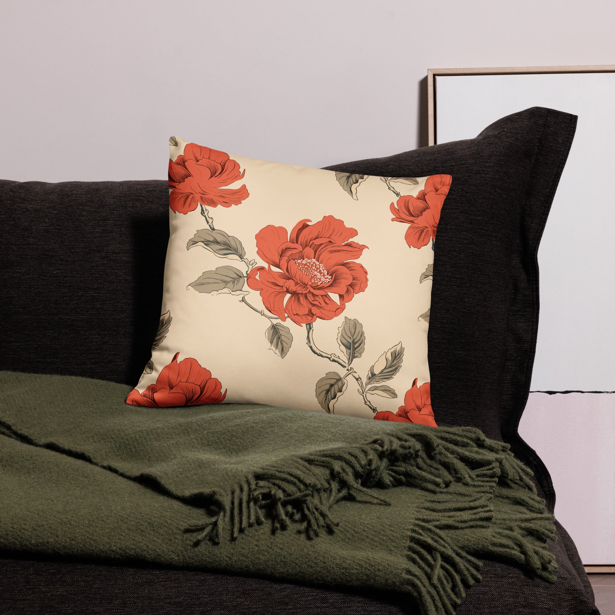 Red peony floral accent pillow on a dark couch, ideal for holiday and winter decor, soft and machine-washable