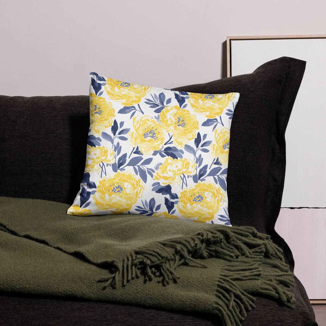 Yellow Peony Bloom Accent Pillow with vibrant yellow flowers and blue leaves on a white background.