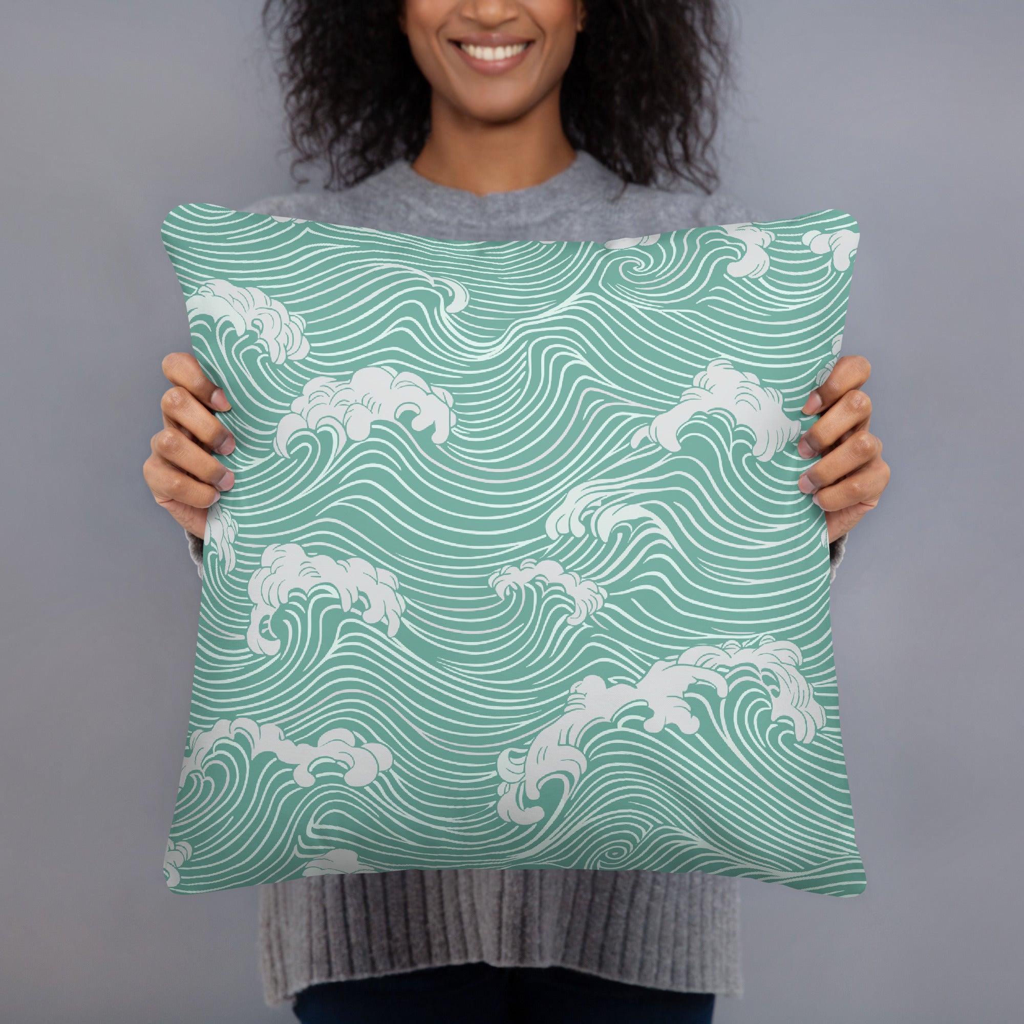 Decorative pillow with mint ocean waves pattern, featuring curved white waves on a knitted fabric, perfect for winter decor.