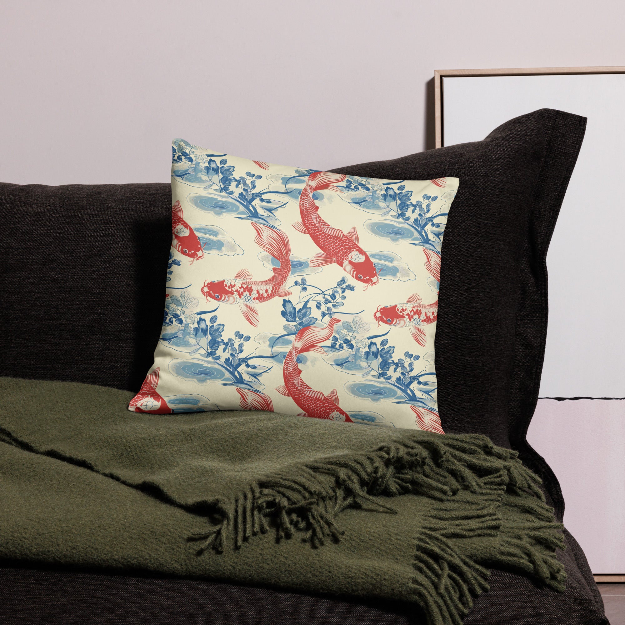 Koi Fish Pattern Knitted Pillow in red and blue colors, perfect for winter home decor, placed on a dark couch with a green throw blanket.