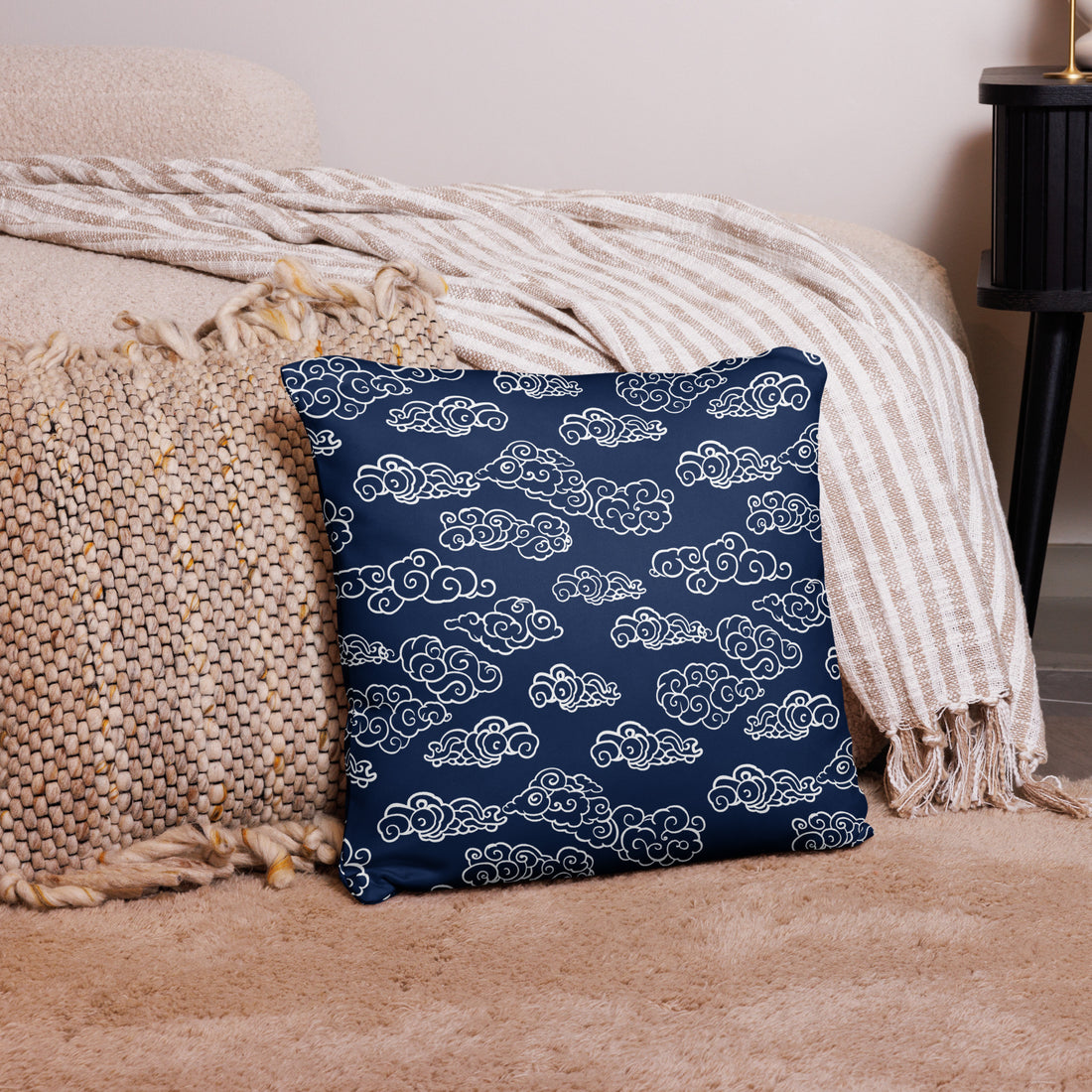 Navy Blue Pillow with White Cloud Pattern on Rug