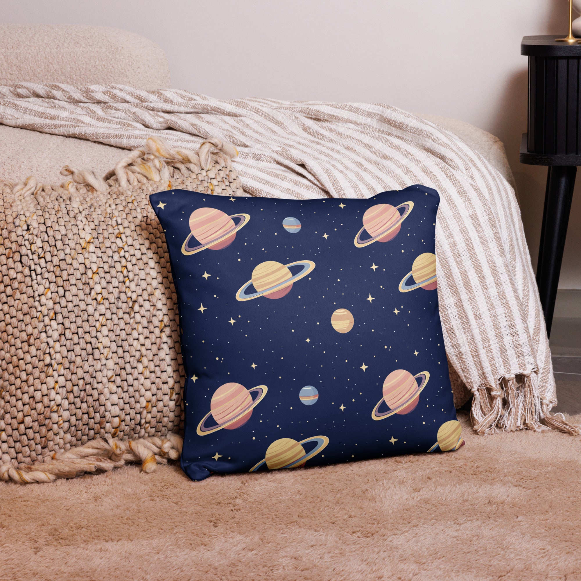 Blue space-themed pillow with colorful planet and star design