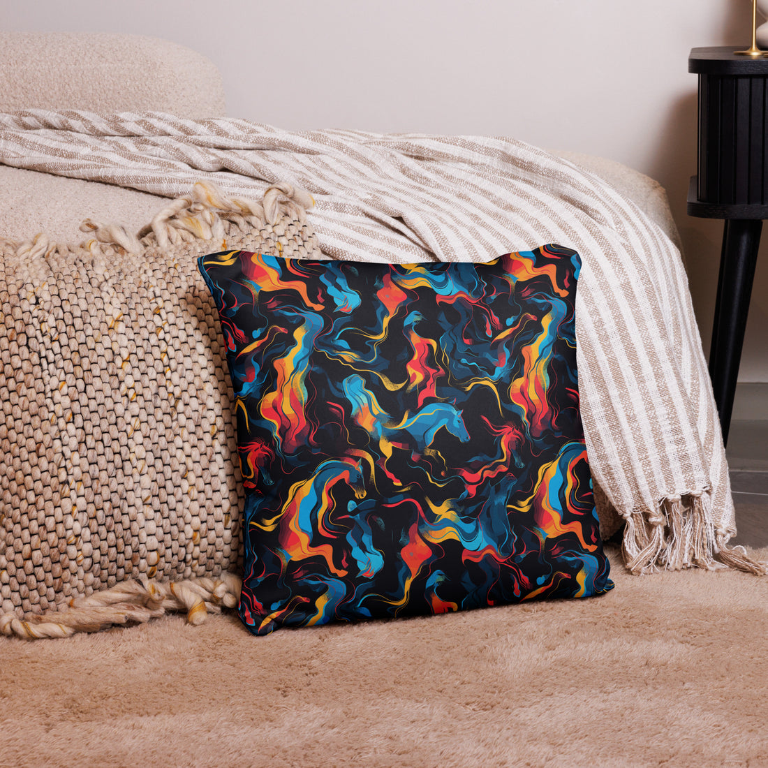 Colorful pillow with vibrant Arctic horse pattern in blues, reds, and yellows on a textured surface.