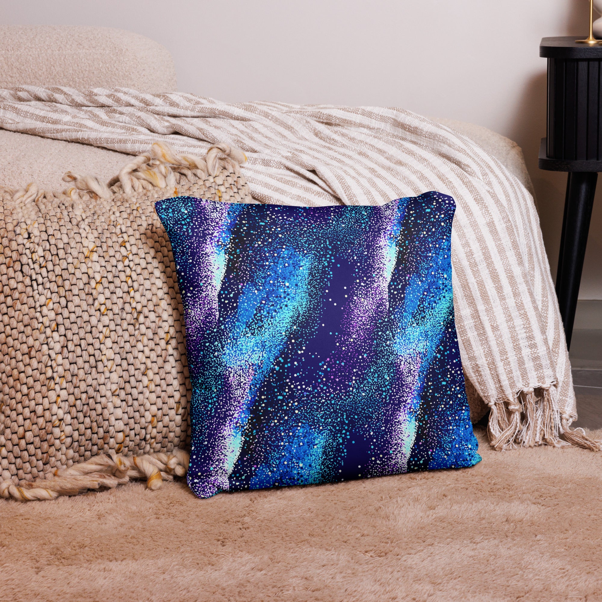 Galaxy Blue Aurora Accent Pillow with cosmic design in blue and purple hues, placed on a cozy room setting