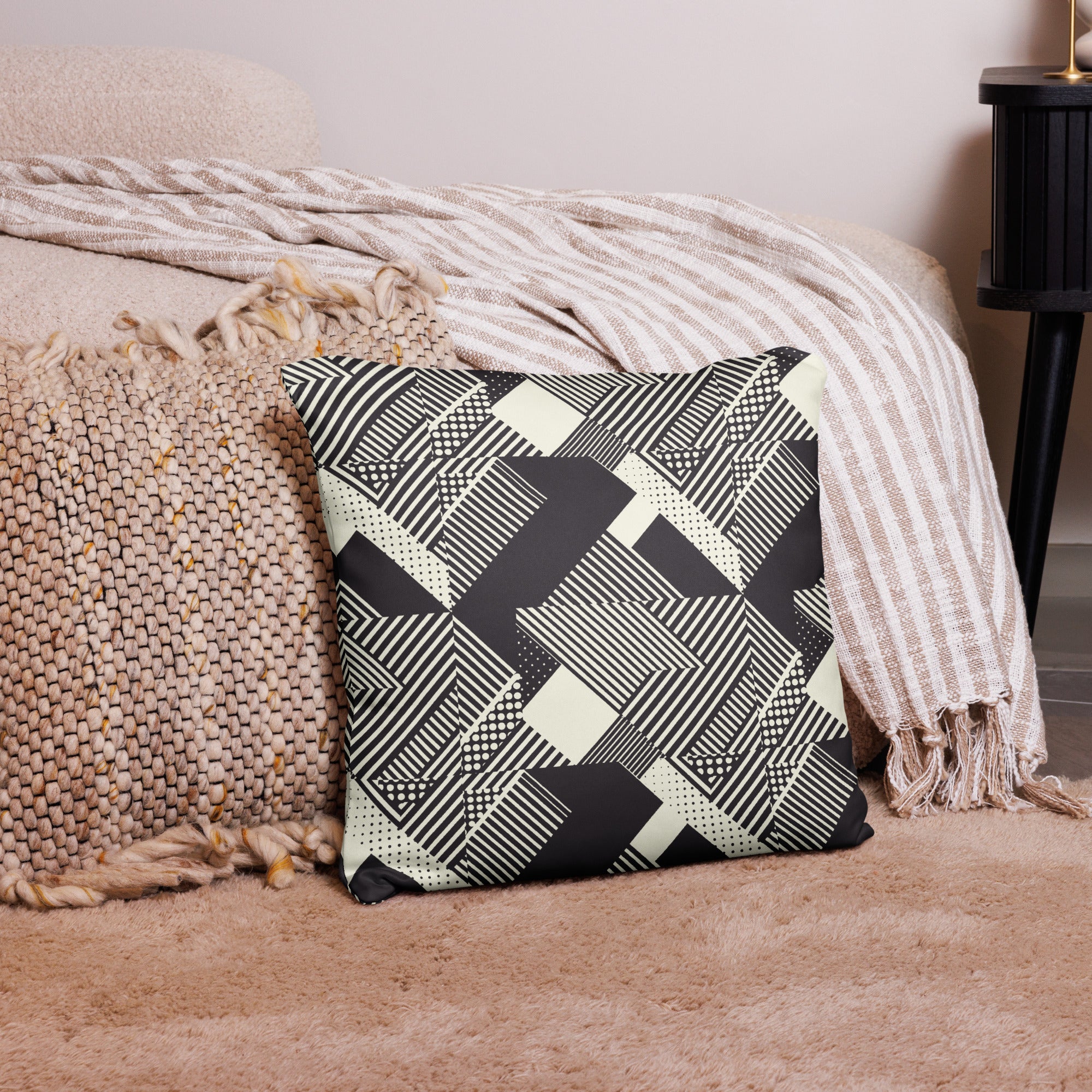 Geometric Art Black and Cream knitted pillow featuring intricate black lines on a cream background.