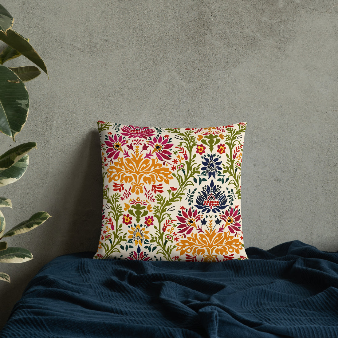 Bohemian floral decorative pillow with vibrant colors on a bed