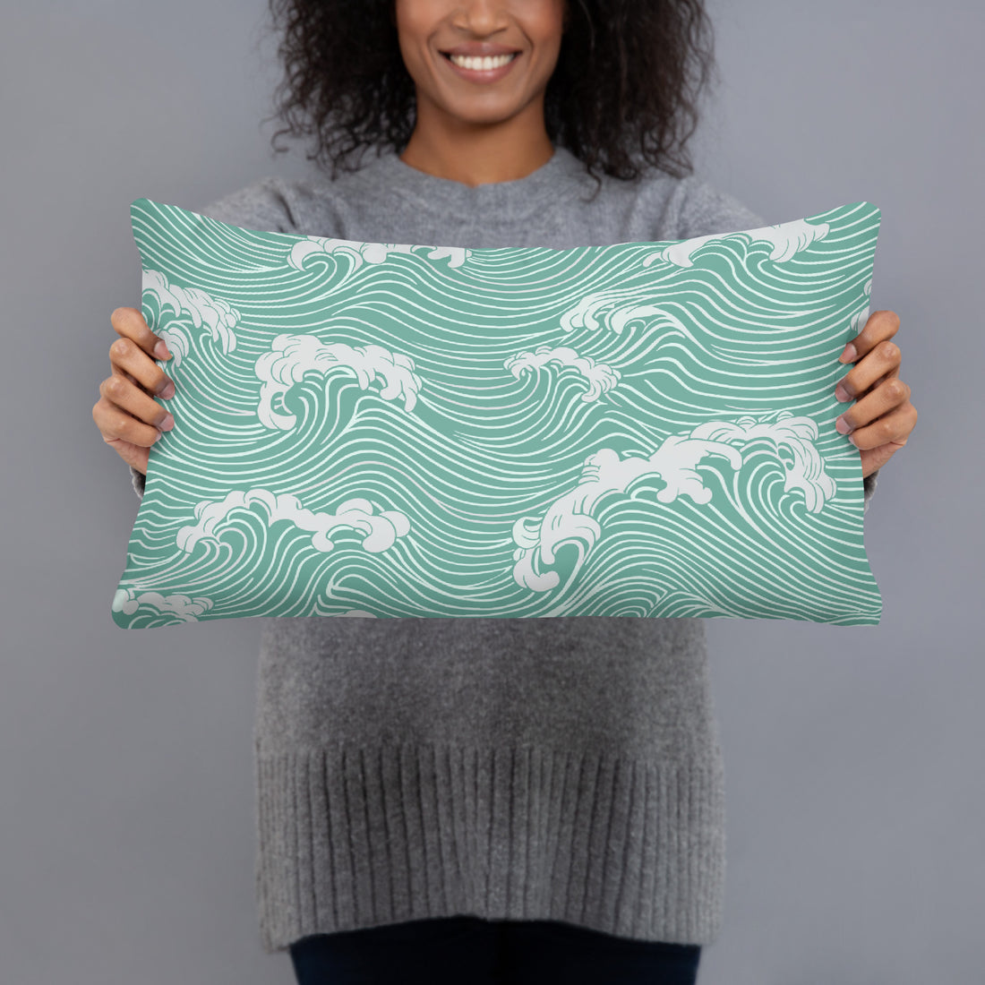 Decorative pillow with mint ocean waves pattern, featuring curved white waves on a knitted fabric, perfect for winter decor.