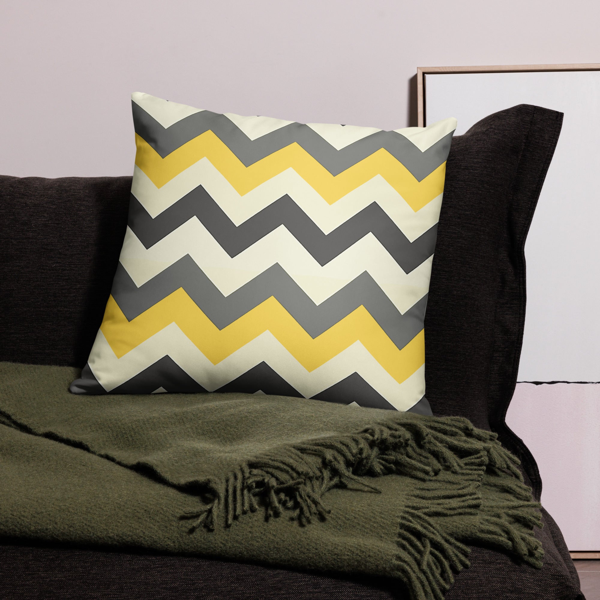 Chevron Pattern Decorative Pillow in yellow and gray on dark sofa.