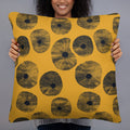 Artisan Floral Print Pillow with yellow background and black floral design in a woman's hands