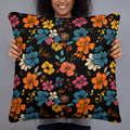 Colorful floral accent pillow featuring vibrant designs on a black backdrop.