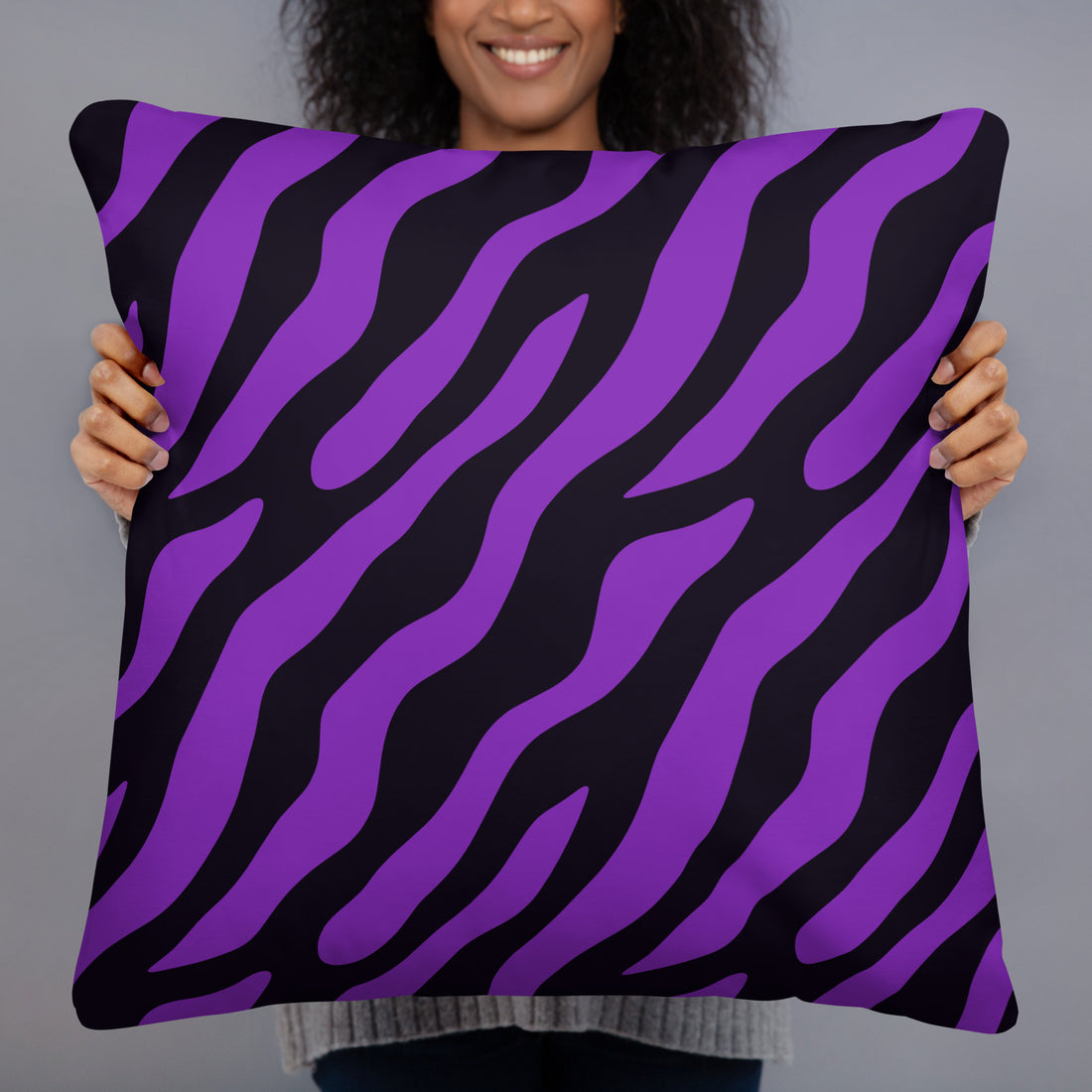 Purple zebra print pillow with hidden zipper held by a smiling woman.