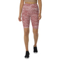 High-waisted biker shorts with a striking red wave pattern, perfect for activewear or casual outfits.