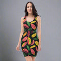 A model wearing a tropical leaf printed bodycon dress featuring vibrant pink, yellow, and green leaves on a black background.