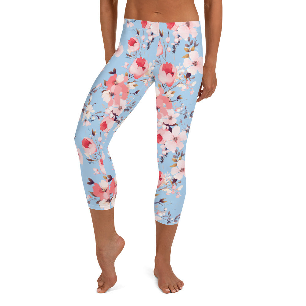 Capri leggings with pastel blossom floral design in pink, white, and blue hues, featuring comfortable microfiber fabric ideal for spring fashion.