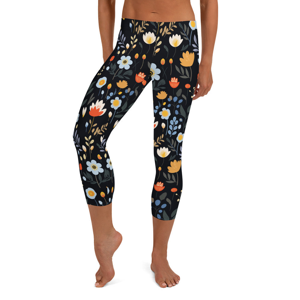 Back view of capri leggings with vibrant floral print in orange, white, and muted blues, showcasing a unique winter fashion design.