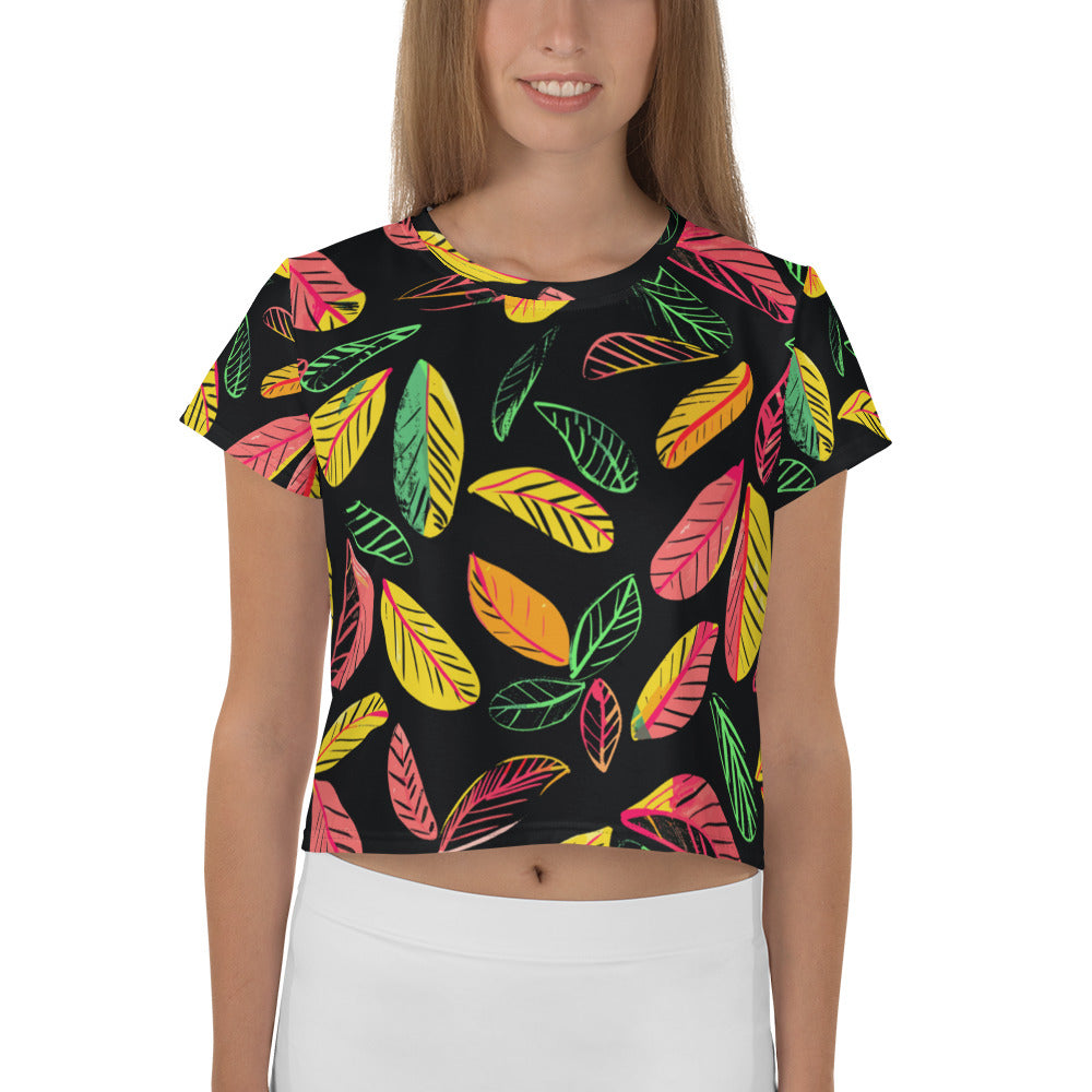 Black crop tee with vibrant leaf print in colorful hues of green, yellow, and pink.