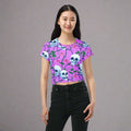 Skull and roses all-over print crop tee featuring a skull design on a lavender background.