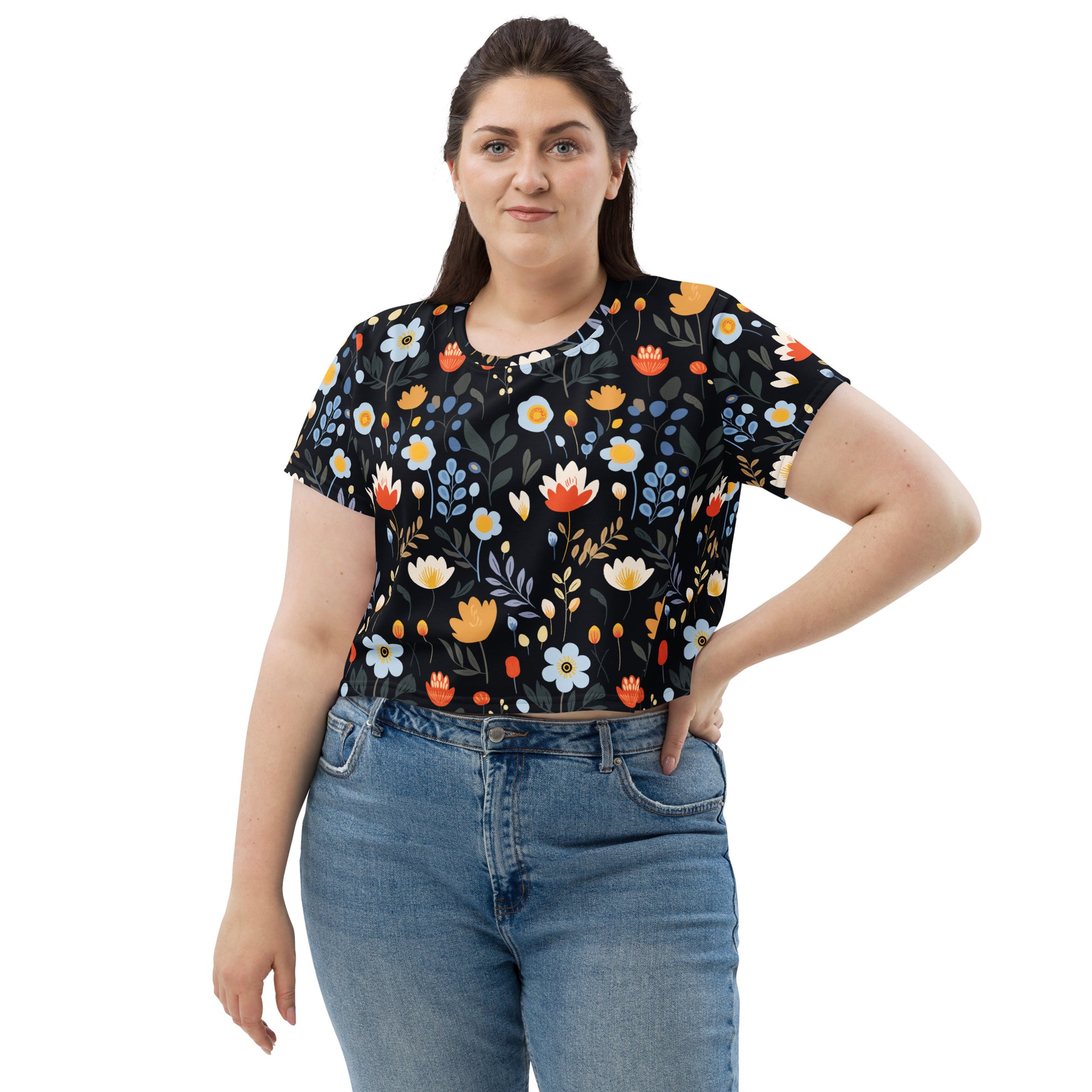 A crop tee featuring vibrant tulips and daisies on a black background, perfect for winter fashion and holiday styling.