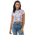 Cherry Blossom design on a sky-blue crop tee with pink and red blossoms, featuring a floral pattern perfect for winter fashion.