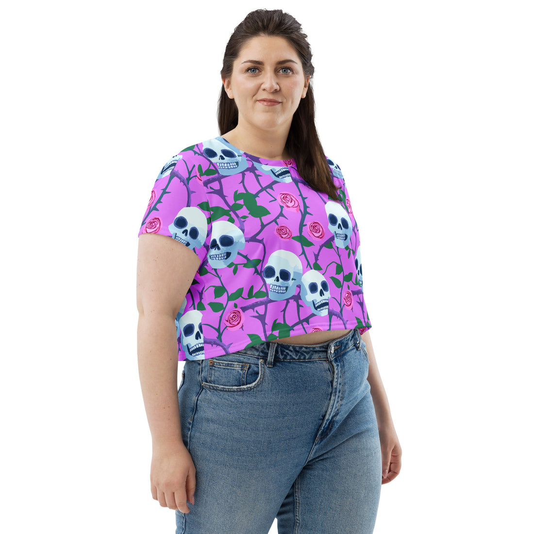 Skull and roses all-over print crop tee featuring a skull design on a lavender background.