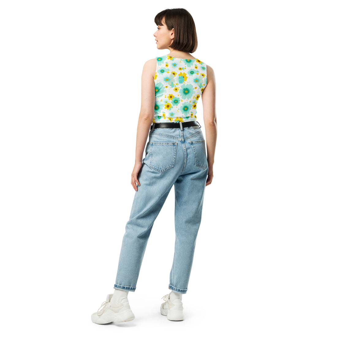 Floral printed body-hugging crop top featuring colorful daisies and turquoise flowers on a light background.