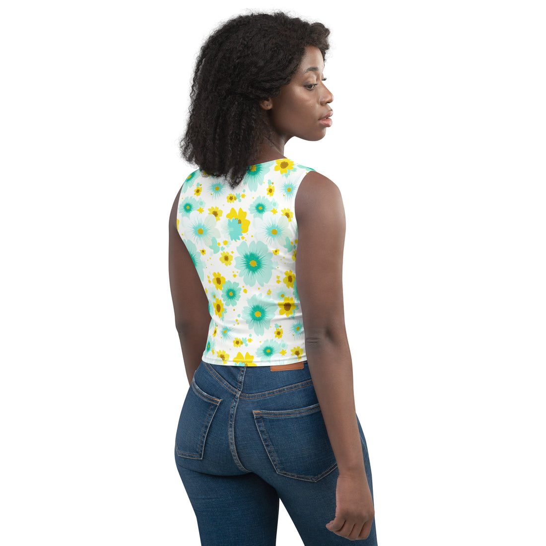 Model wearing a floral print body-hugging crop top with vibrant flowers in turquoise and yellow.