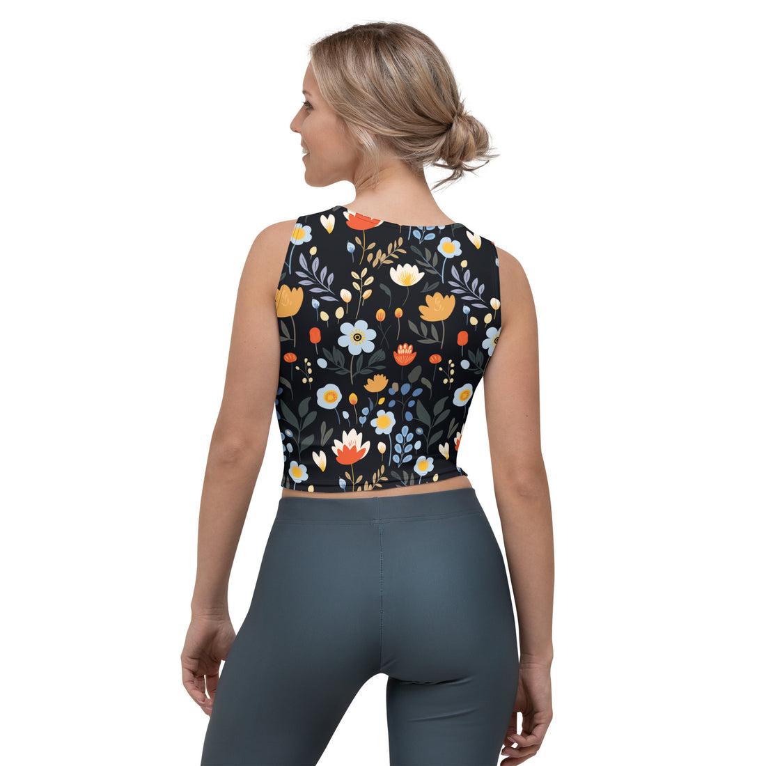 Crop top with vibrant winter floral design on a black background, featuring orange, white, and blue flowers, perfect for holiday fashion.