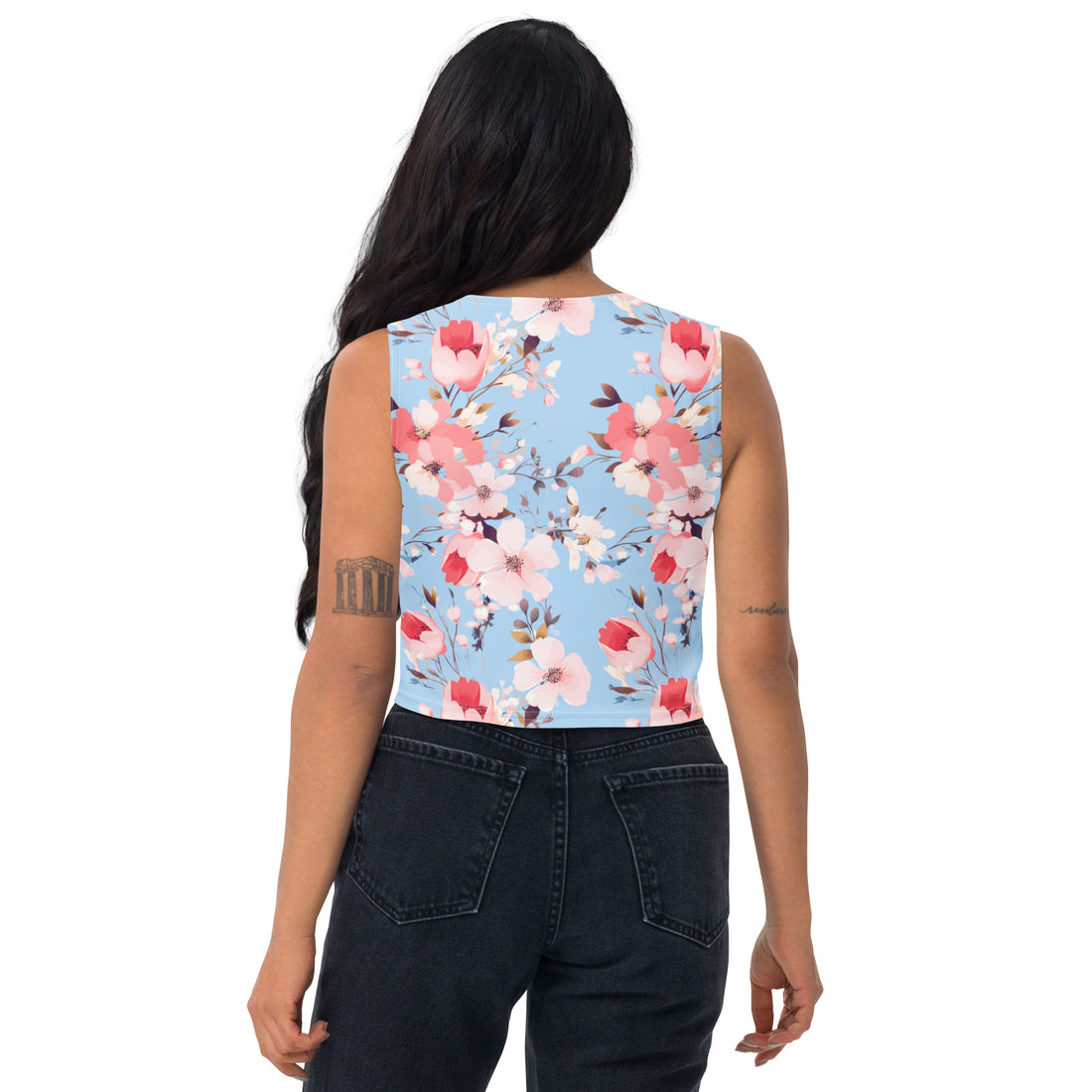 Sky-blue crop top with cherry blossom prints, worn by a model, showcasing a harmonious blend of style and nature.