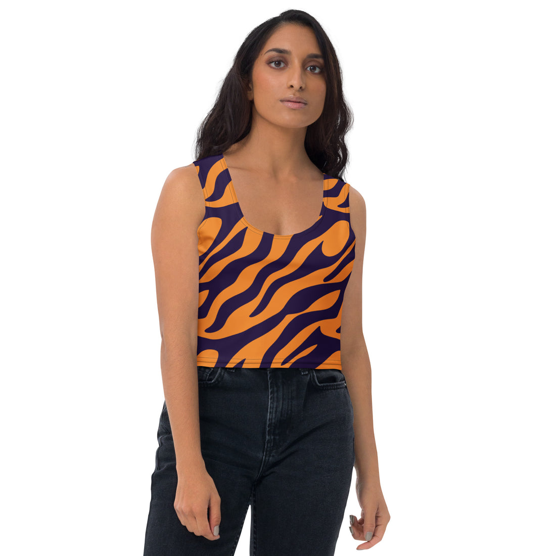 Bold tiger print crop top in vibrant orange and purple on model.