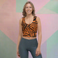 Model wearing a body-hugging crop top with vibrant tiger stripes in orange and black.