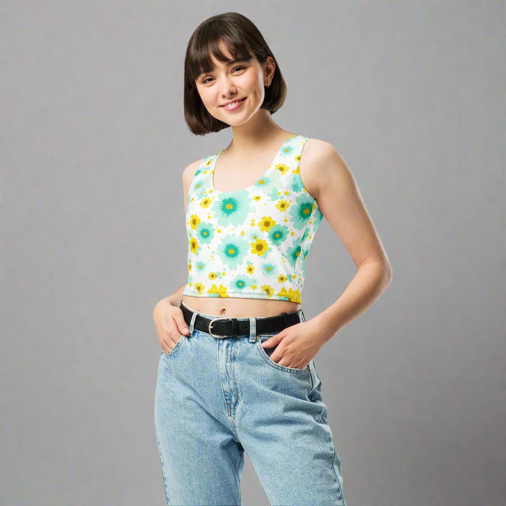 Floral printed body-hugging crop top featuring colorful daisies and turquoise flowers on a light background.