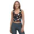 Crop top with vibrant winter floral design on a black background, featuring orange, white, and blue flowers, perfect for holiday fashion.