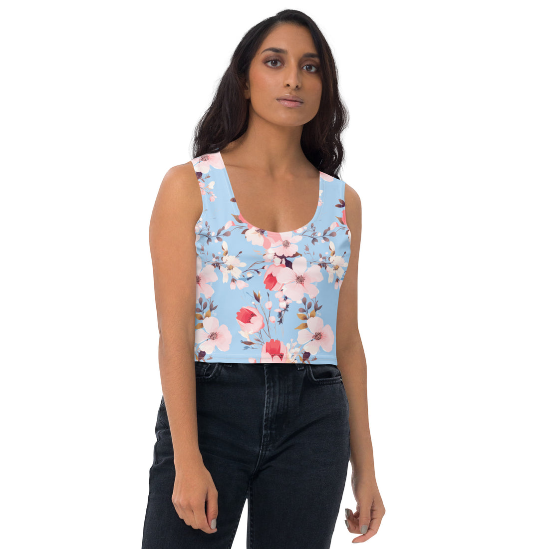 Sky-blue crop top with cherry blossom prints, worn by a model, showcasing a harmonious blend of style and nature.