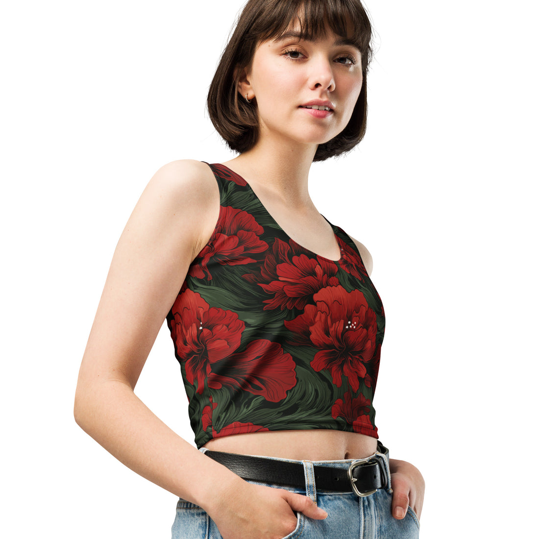 Floral print crop top featuring vibrant red flowers on a dark background, worn casually with denim shorts.