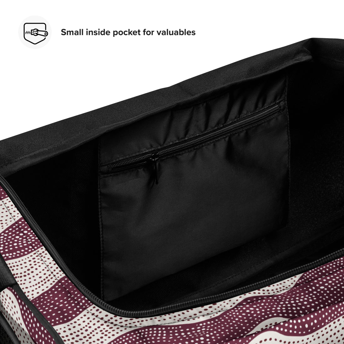 Stylish duffle bag with maroon wave pattern against cream background.