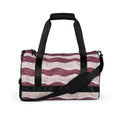 Wavy pattern gym bag in maroon and cream with dual padded handles and adjustable strap.