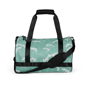 Wave pattern gym bag in turquoise with black straps and padded handles.