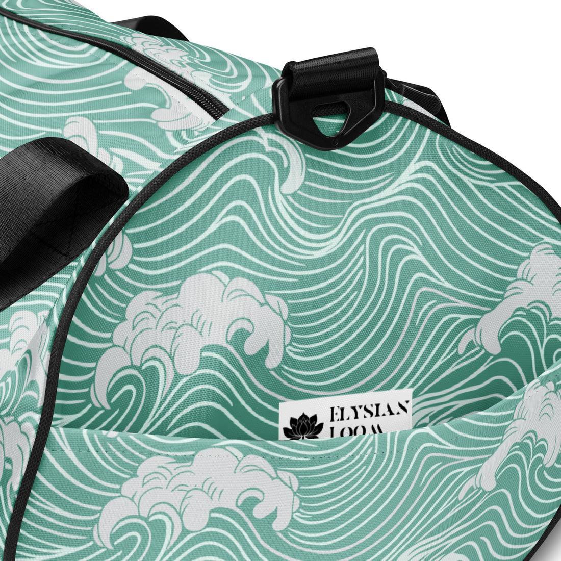 Wave pattern gym bag in turquoise with black straps and padded handles.