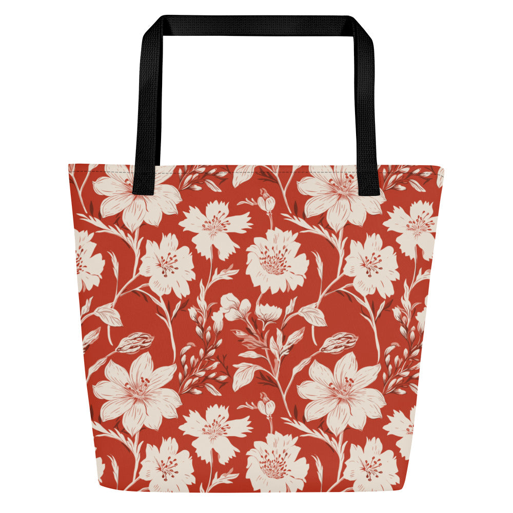 Vibrant floral print large tote bag with black handles, featuring a rust background and white flowers.