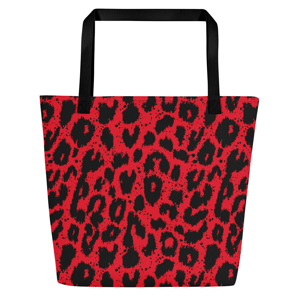 Vibrant red leopard print large tote bag with black handles, perfect for beach outings.