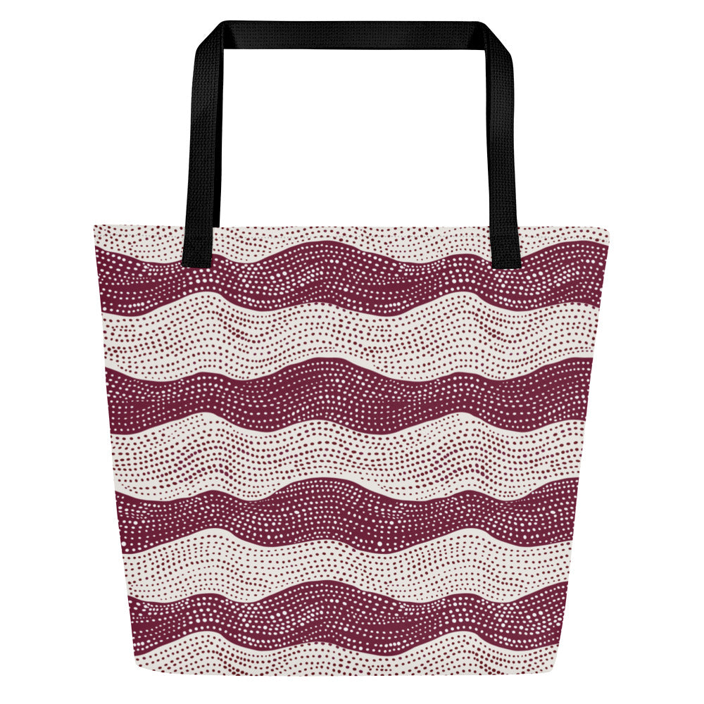 Large tote bag with a stylish red wavy pattern on cream background and black handles.