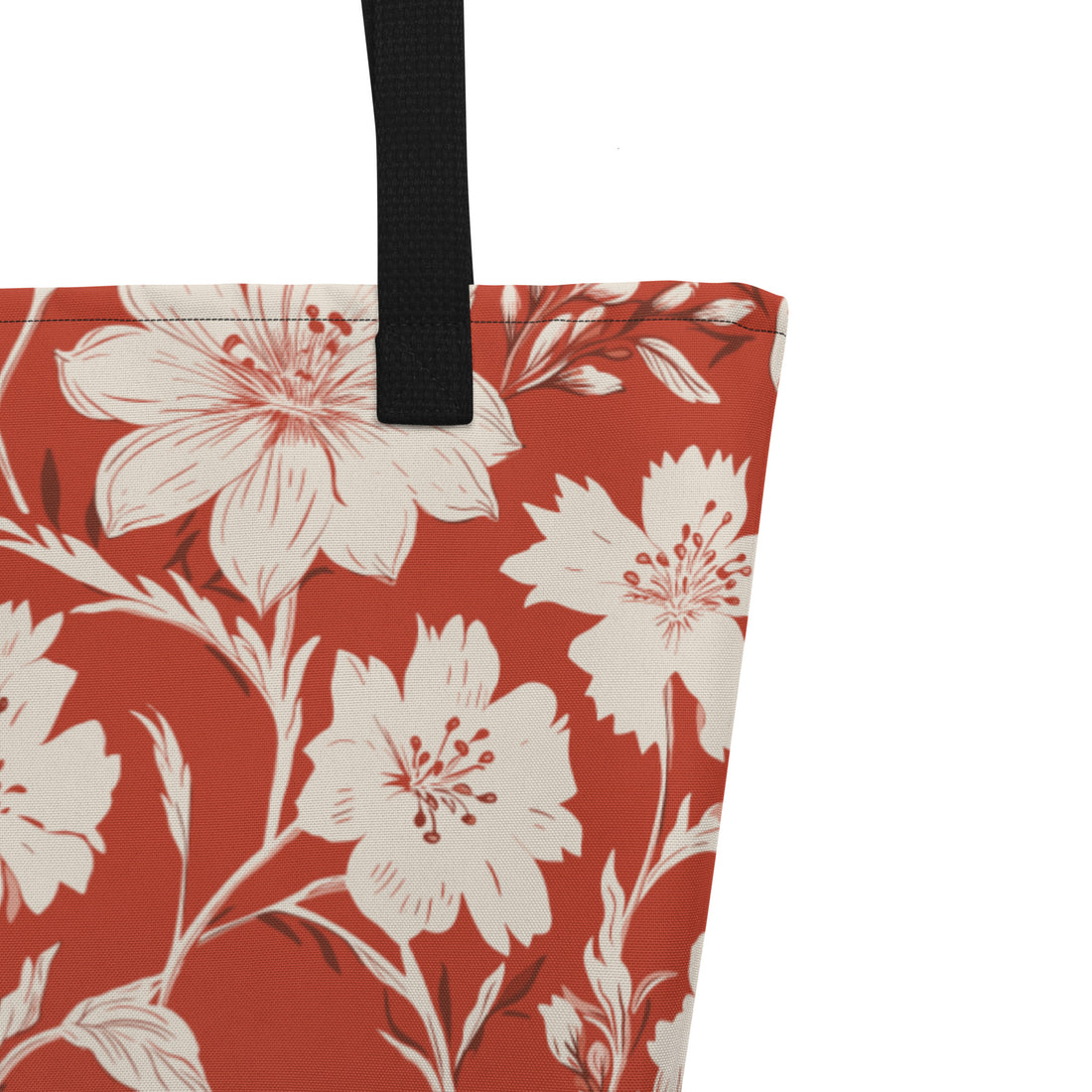 Vibrant floral print large tote bag with black handles, featuring a rust background and white flowers.