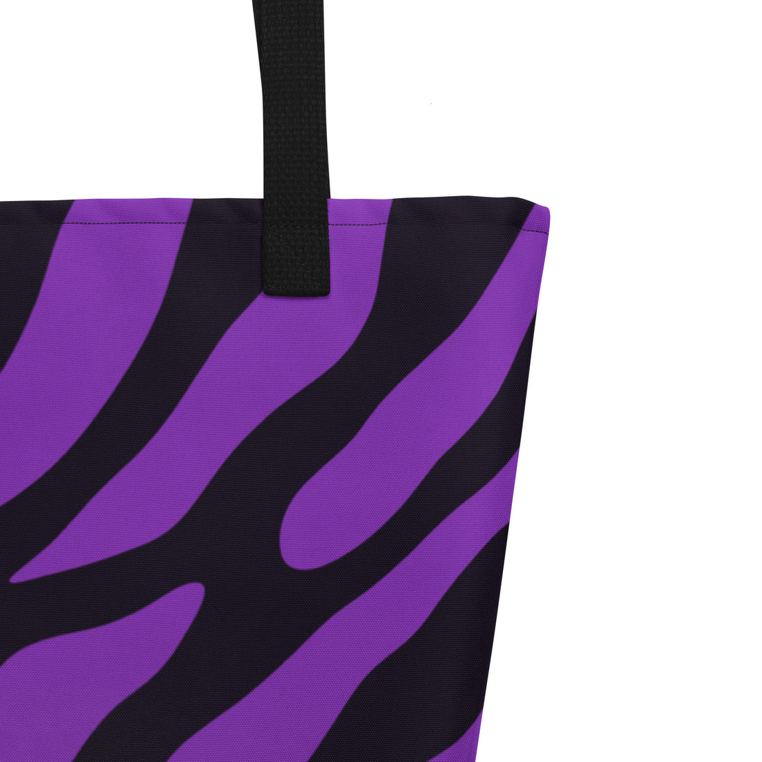 Vibrant purple zebra print tote bag with black handles, perfect for the beach or daily use.