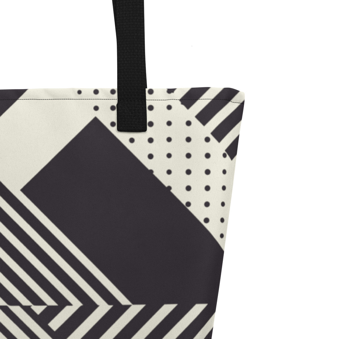 Geometric striped large tote bag in black and cream color with bold patterns.