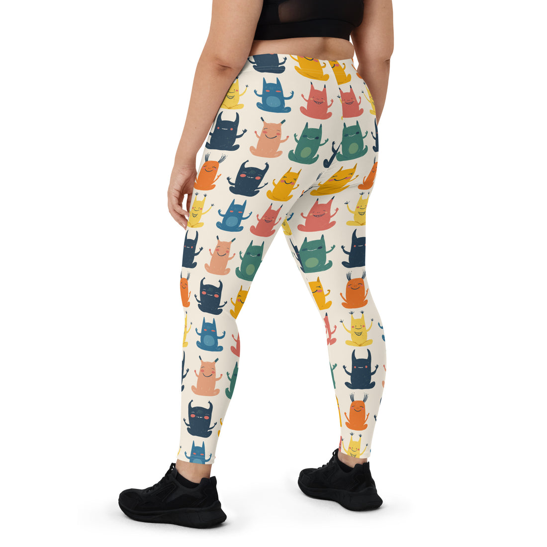 Women's whimsical Halloween monster leggings featuring colorful monster designs on a light background.